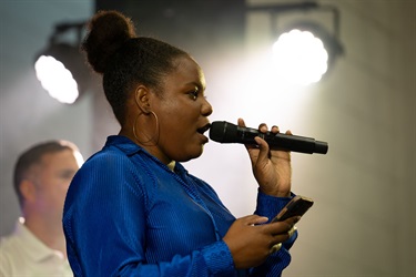 This is a photo of an artist performing at the 2024 Kissimmee Juneteenth Festival.