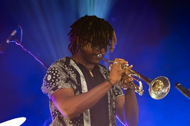 This is a photo of an artist performing at the 2024 Kissimmee Juneteenth Festival.