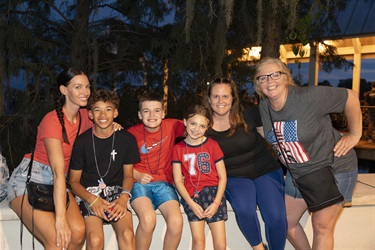 Family in patriotic clothes at Monumental 4th of July in Kissimmee. 